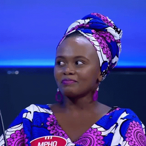 A Woman Wearing A Head Scarf Has A Name Tag That Reads Mpho GIF