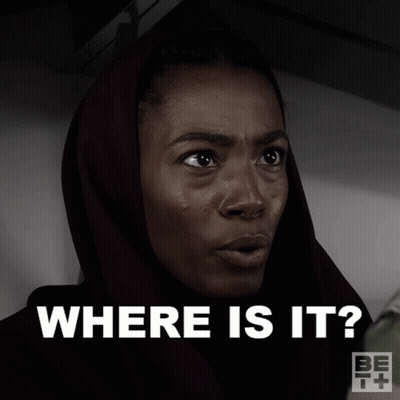 A Woman Wearing A Head Scarf Is Asking Where Is It GIF
