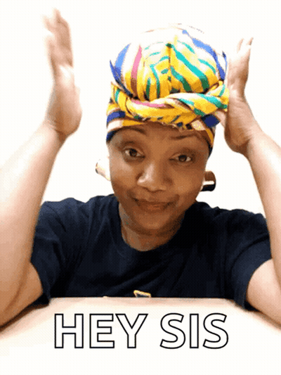 A Woman Wearing A Head Scarf Is Sitting At A Table And Says Hey Sis GIF