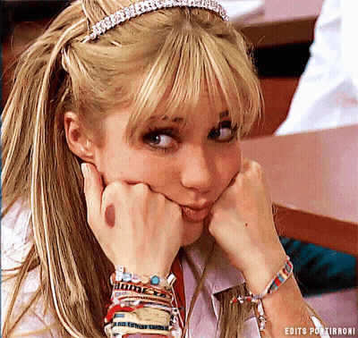A Woman Wearing A Headband And Bracelets Has Her Hands On Her Face GIF
