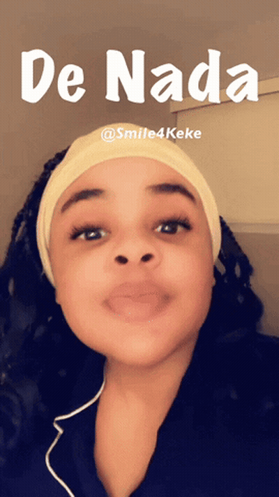 A Woman Wearing A Headband With The Word De Nada Written On It GIF