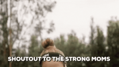 A Woman Wearing A Headband With The Words `` Shout Out To The Strong Moms '' Written On It . GIF