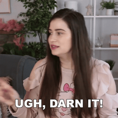 A Woman Wearing A Hello Kitty Shirt Says " Ugh Darn It " GIF