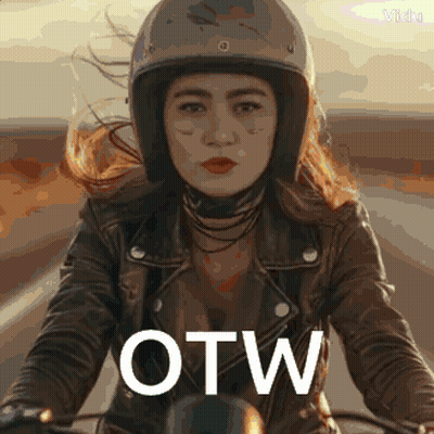 A Woman Wearing A Helmet And A Leather Jacket Is Riding A Motorcycle With The Word Otw Written On The Front GIF
