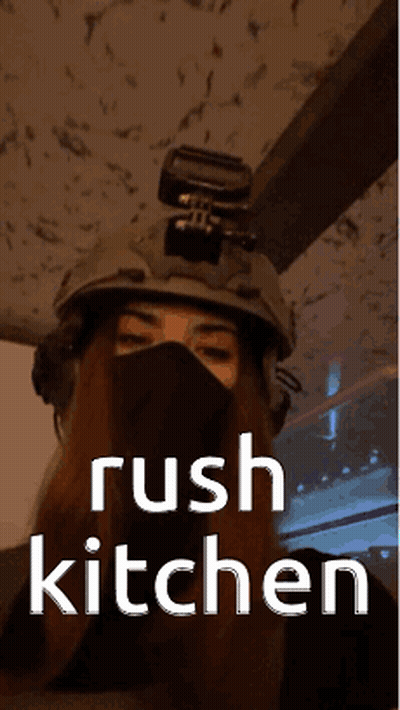 A Woman Wearing A Helmet And A Mask With The Words Rush Kitchen On The Bottom GIF