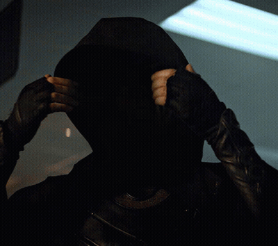 A Woman Wearing A Helmet With Horns On Her Head Looks At The Camera GIF