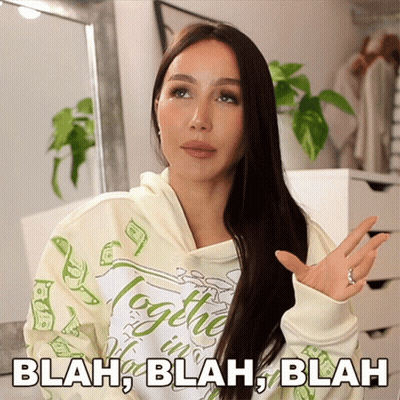 A Woman Wearing A Hoodie That Says Blah Blah Blah On It GIF