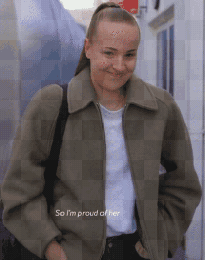 A Woman Wearing A Jacket And A White Shirt Says " So I 'M Proud Of Her " GIF