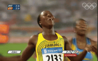A Woman Wearing A Jamaica Jersey With The Number 2133 On It GIF
