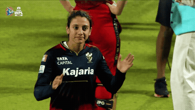 A Woman Wearing A Jersey That Says Kajaria GIF