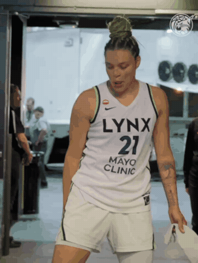 A Woman Wearing A Jersey That Says Lynx Mayo Clinic GIF