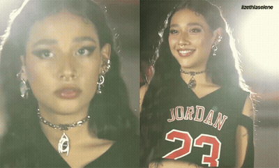 A Woman Wearing A Jordan 23 Jersey Smiles GIF