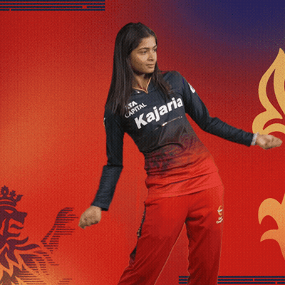A Woman Wearing A Kajaria Jersey Is Dancing GIF
