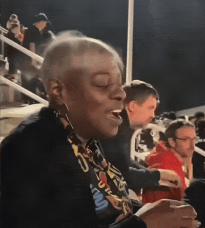 A Woman Wearing A Lanyard That Says ' U.s.a. ' On It GIF