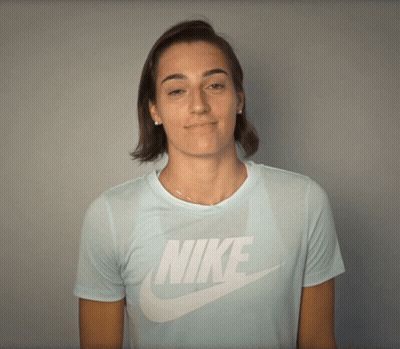 A Woman Wearing A Light Blue Nike T-Shirt GIF