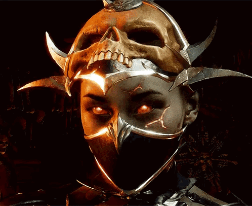 A Woman Wearing A Mask With A Skull On Top Of Her Head GIF