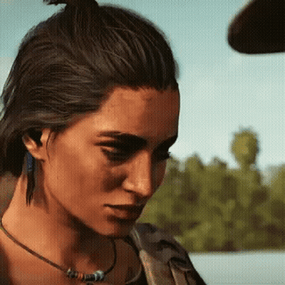 A Woman Wearing A Necklace And Earrings Is Looking Down At Something . GIF