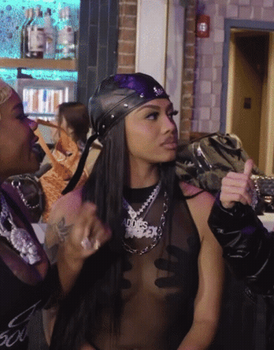 A Woman Wearing A Necklace That Says ' Abbies ' On It GIF