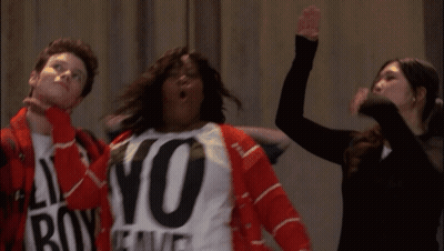 A Woman Wearing A No Weave Shirt Stands Next To A Man And A Woman GIF