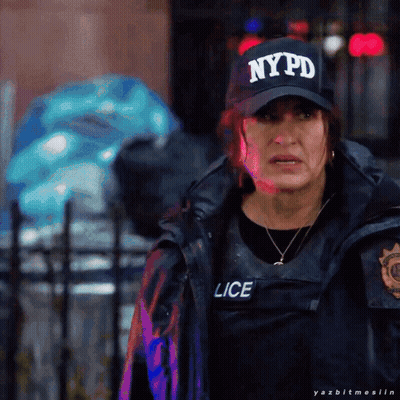 A Woman Wearing A Nypd Hat And A Black Vest GIF