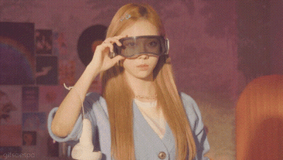 A Woman Wearing A Pair Of Virtual Reality Goggles With Gifsaesoa Written On The Bottom Right GIF
