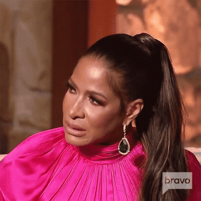 A Woman Wearing A Pink Dress And Earrings Is On Bravo Television GIF