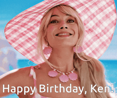 A Woman Wearing A Pink Hat And A Pink Necklace Is Smiling And Says Happy Birthday Ken GIF