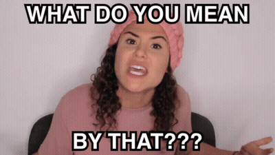 A Woman Wearing A Pink Hat And A Pink Shirt Says What Do You Mean By That GIF