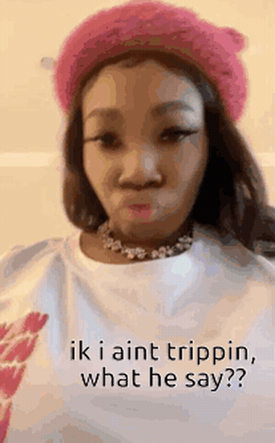 A Woman Wearing A Pink Hat And A White Shirt With The Words `` Ik I Aint Trippin , What He Say '' . GIF