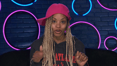 A Woman Wearing A Pink Hat And An Atlanta Sweatshirt GIF