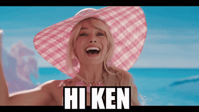 A Woman Wearing A Pink Hat With The Word Hi Ken On The Bottom GIF