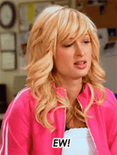 A Woman Wearing A Pink Jacket Says Ew GIF
