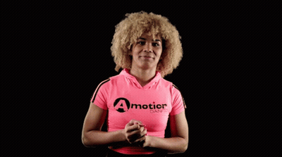 A Woman Wearing A Pink Shirt That Says A Motion Dance On It GIF