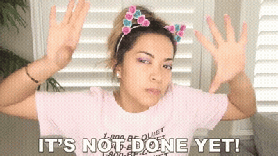 A Woman Wearing A Pink Shirt With The Words It 'S Not Done Yet Written On It GIF