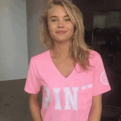 A Woman Wearing A Pink T-Shirt With The Word Pin On It GIF