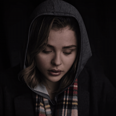 A Woman Wearing A Plaid Scarf And A Hoodie GIF