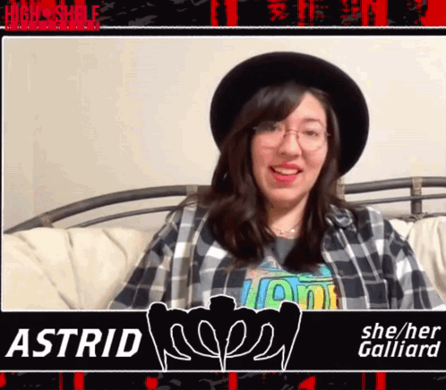 A Woman Wearing A Plaid Shirt And A Hat With The Name Astrid GIF