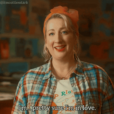 A Woman Wearing A Plaid Shirt And An Orange Headband Says I 'M Pretty Sure I 'M In Love GIF