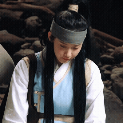 A Woman Wearing A Ponytail And A Headband With The Letters Eeea On The Bottom GIF