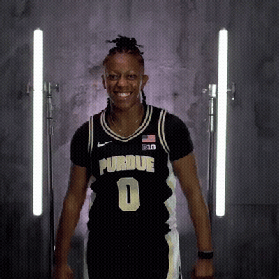 A Woman Wearing A Purdue Jersey Number 0 GIF