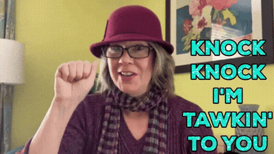 A Woman Wearing A Purple Hat And Scarf Says " Knock Knock I 'M Tawkin To You " GIF