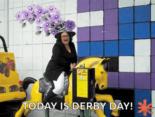 A Woman Wearing A Purple Hat Is Riding A Yellow Horse With The Words Today Is Derby Day Behind Her GIF