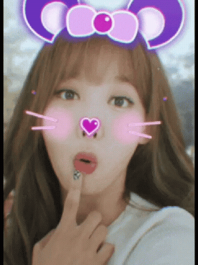 A Woman Wearing A Purple Headband With A Heart On It GIF