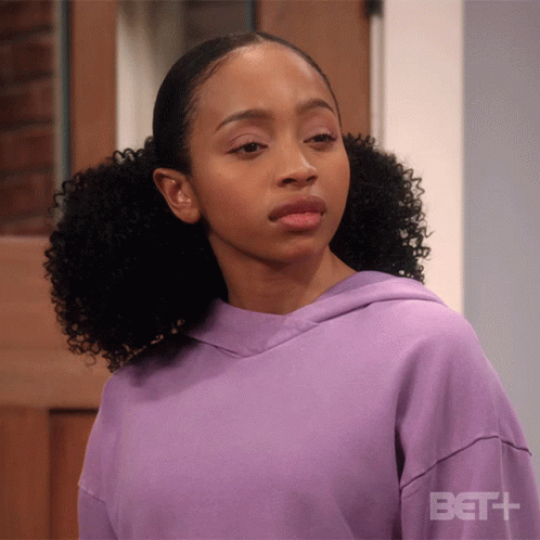 A Woman Wearing A Purple Hoodie With Bet + Written On The Sleeve GIF
