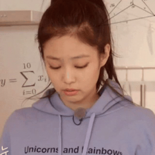 A Woman Wearing A Purple Hoodie With The Words Unicorns And Rainbows On It GIF