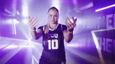 A Woman Wearing A Purple Jersey With The Number 10 GIF