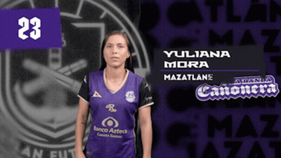 A Woman Wearing A Purple Jersey With The Number 23 GIF