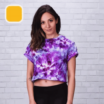 A Woman Wearing A Purple Tie Dye Crop Top GIF