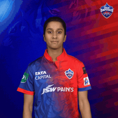 A Woman Wearing A Red And Blue Shirt That Says J & W Paints GIF