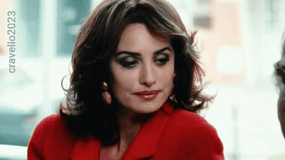A Woman Wearing A Red Coat Has The Year 2023 On The Bottom Right GIF